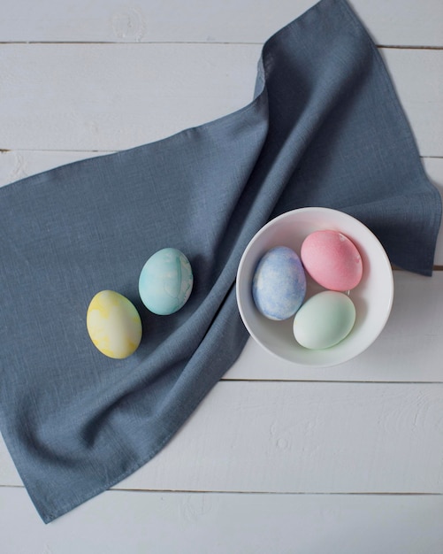 Colorful Easter eggs are lying on the table