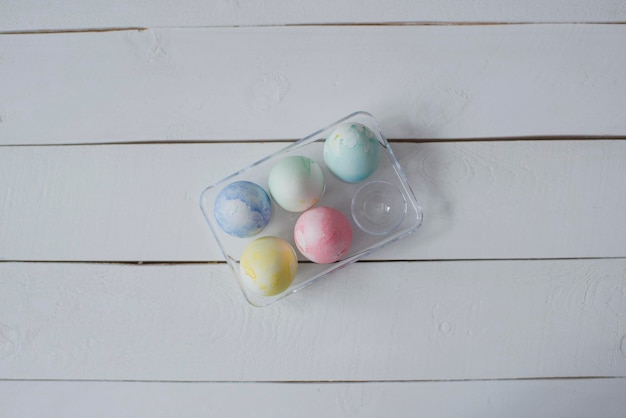 Colorful Easter eggs are lying on the table