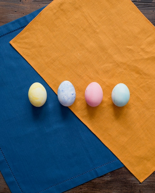 Colorful Easter eggs are lying on the table