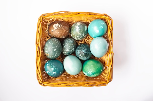 Colorful Easter eggs in a basket Traditional festive decor