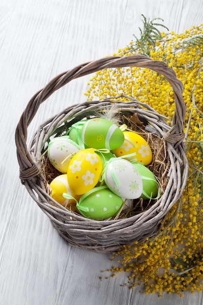 Colorful easter eggs in basket