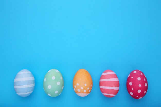 Colorful easter eggs on a blue 