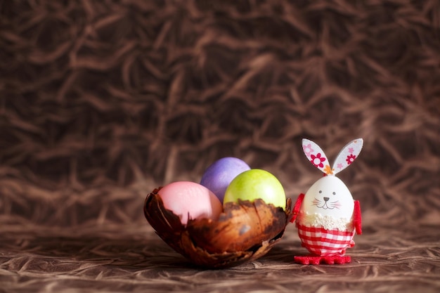 Colorful Easter eggs bowl and bunny rabbit