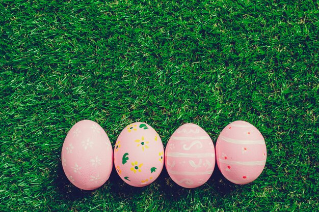 Colorful easter eggs on green grass