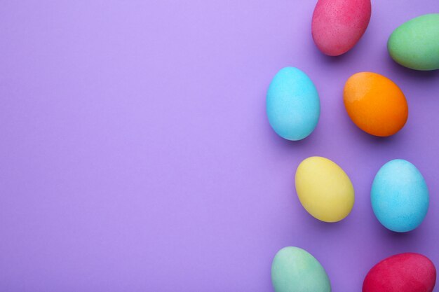 Colorful easter eggs on a purple 