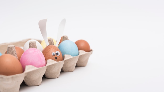 Colorful Easter eggs in rack on table