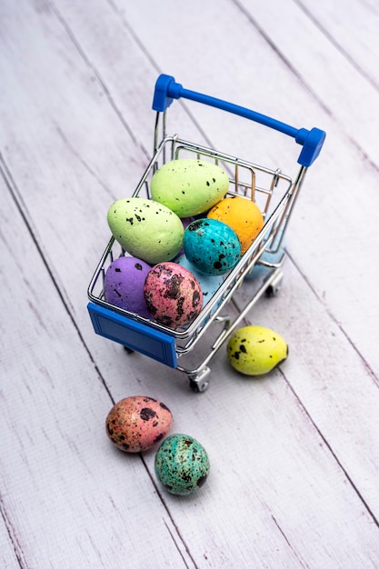 Colorful Easter eggs in a supermarket cart Easter greeting card