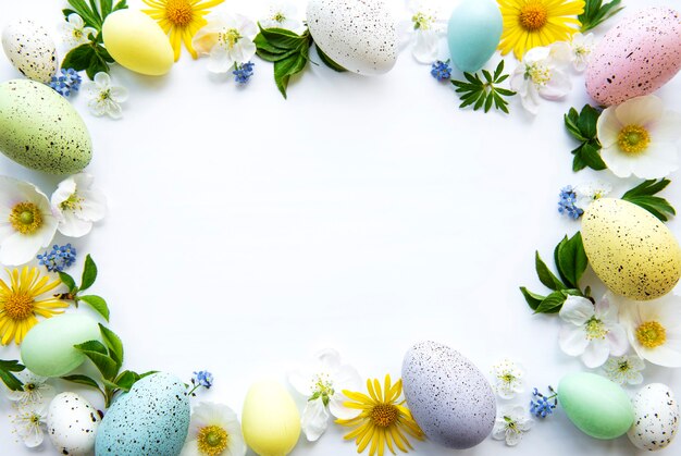 Colorful Easter eggs with spring blossom flowers