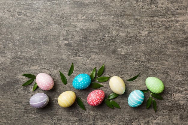 Colorful Easter eggs with spring flower leaf isolated over white background Colored Egg Holiday border