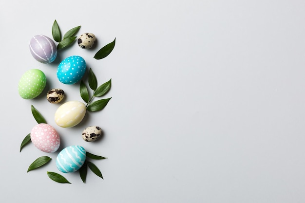 Colorful Easter eggs with spring flower leaf isolated over white background Colored Egg Holiday border