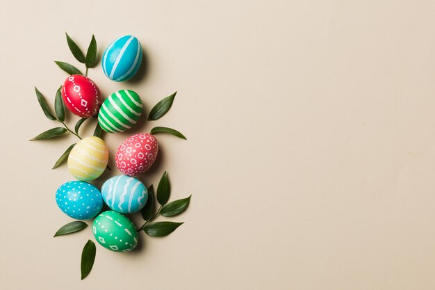 Colorful Easter eggs with spring flower leaf isolated over white background Colored Egg Holiday border