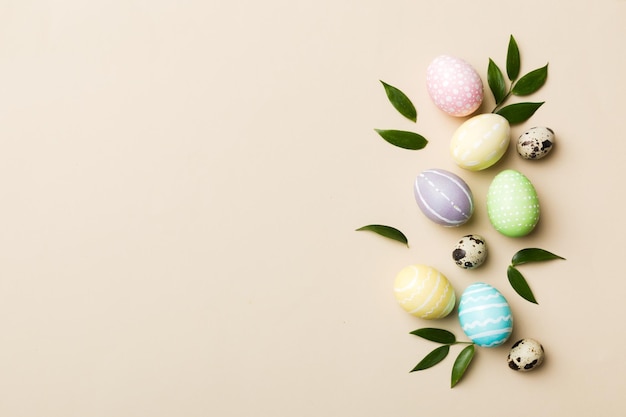 Colorful Easter eggs with spring flower leaf isolated over white background Colored Egg Holiday border