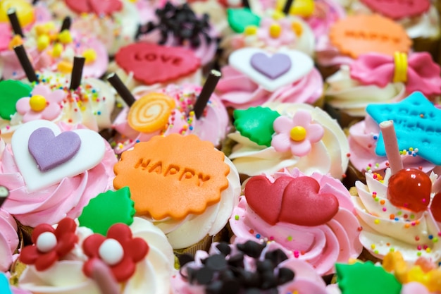 colorful fancy cupcakes on top view