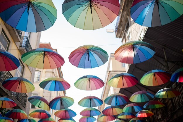 Colorful floating umbrellas hang above the street