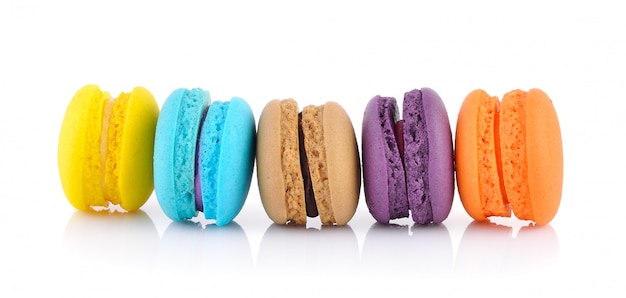 Colorful french macarons on white wall