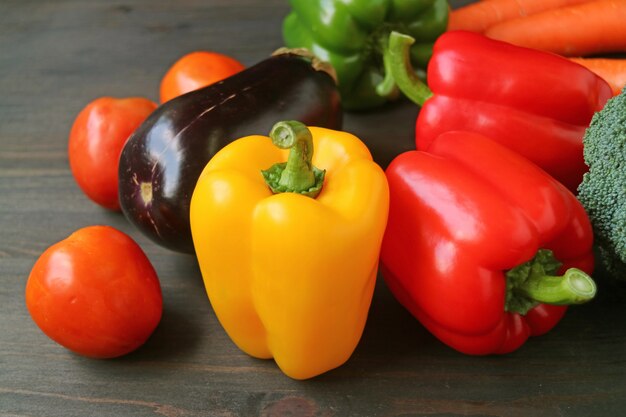 Colorful fresh vegetables on dark brown wooden table