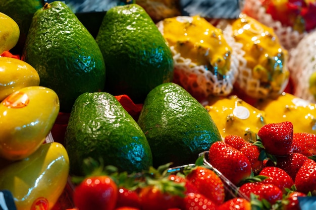 Colorful fruit berries are displayed in a market