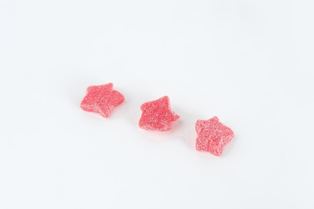 Colorful fruit jelly candy on white background Copy space selective focus image