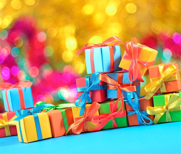 Colorful gifts close-up on a bokeh background