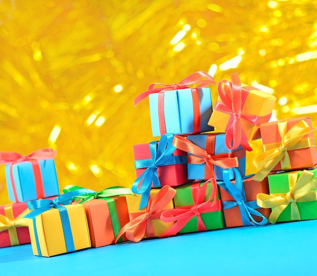 Colorful gifts close-up on a bokeh background