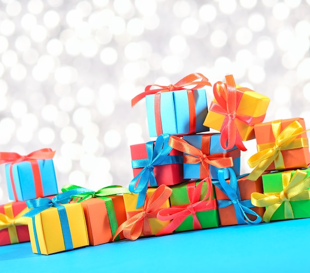 Colorful gifts close-up on a bokeh background