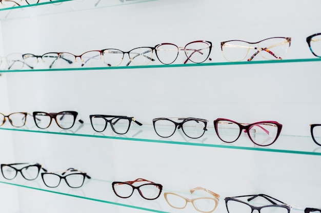 Colorful glasses frames on display in shop