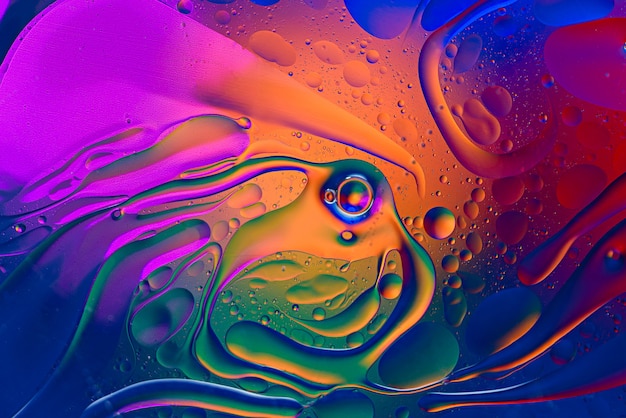 Colorful gradient background of oil drops on water surface. art background concept