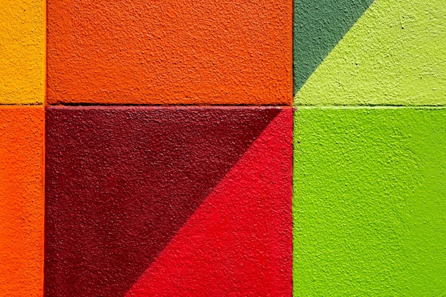 Colorful green red and yellow brick wall as background texture