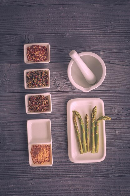 Colorful herbs and spices for cooking Indian spices On a black stone background