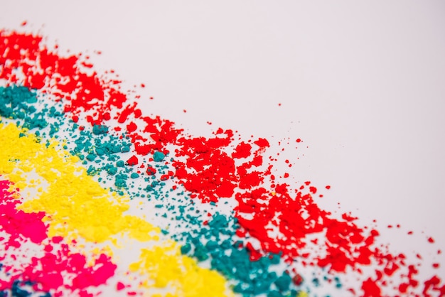 Colorful Holi powder on white background