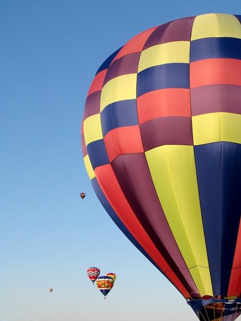 Colorful hot air balloons and blue sky as a background