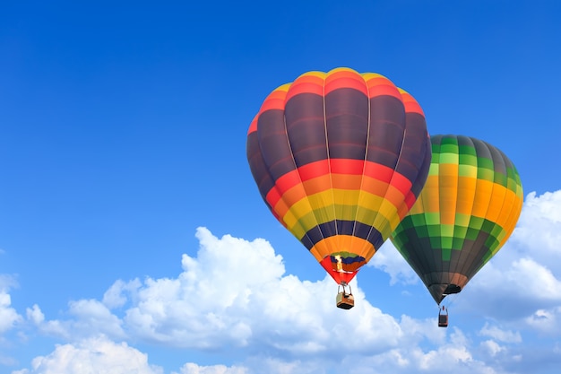 Colorful Hot Air Balloons in Flight over blue sky