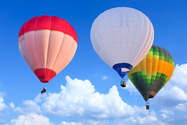 Colorful Hot Air Balloons in Flight over blue sky