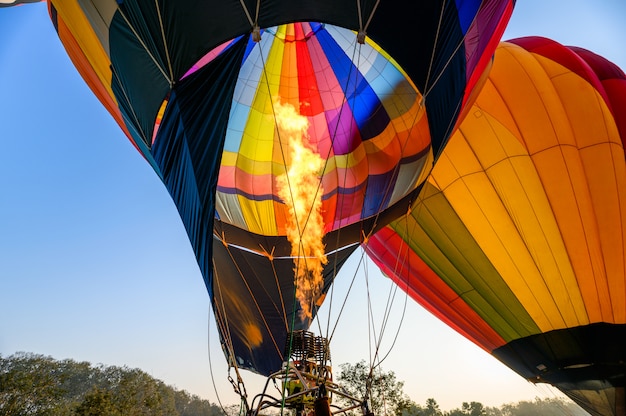 Colorful hot air balloons with burning an inflatable