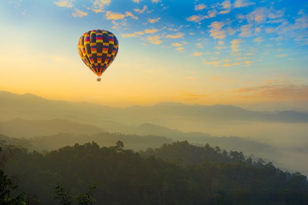 Colorful hotair balloons flying over the mountain