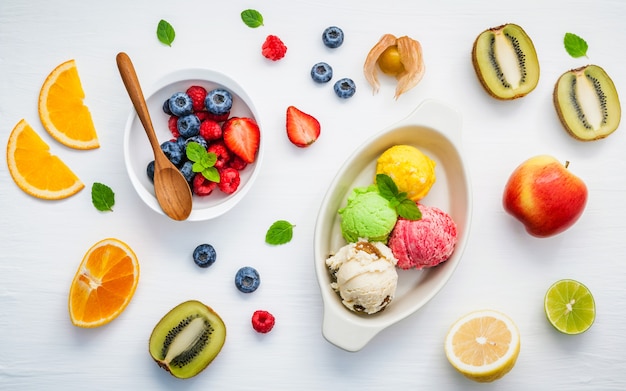 Colorful ice cream with mixed berry and various fruits setup on white background . 