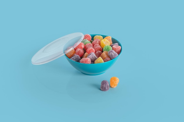 Colorful jelly bean in bowl isolated on colorful background