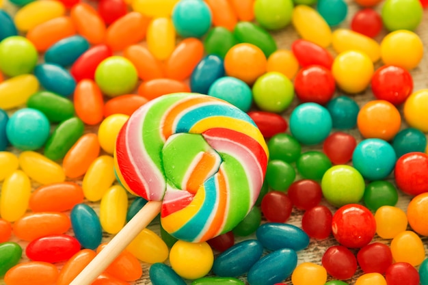 Colorful jelly beans close to wallpaper