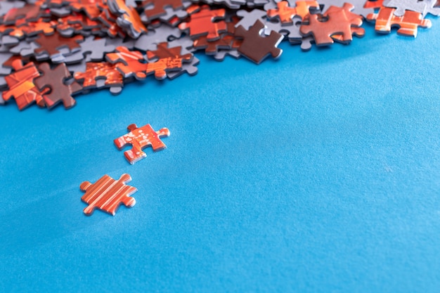 Colorful jigsaw puzzle on blue background