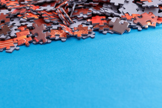 Colorful jigsaw puzzle on blue background