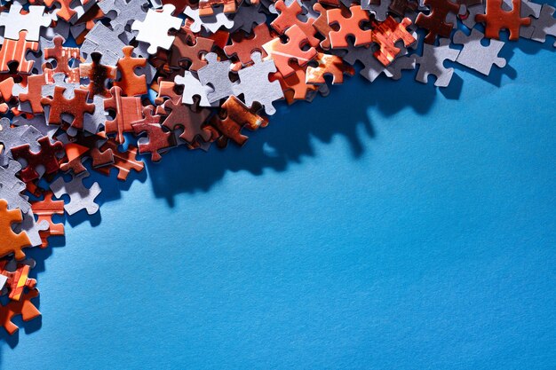 Colorful jigsaw puzzle on blue background