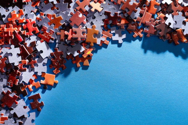 Colorful jigsaw puzzle on blue background