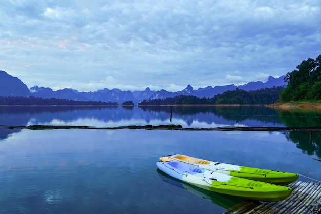 Colorful kayaks on the raft. lagoon mountain view