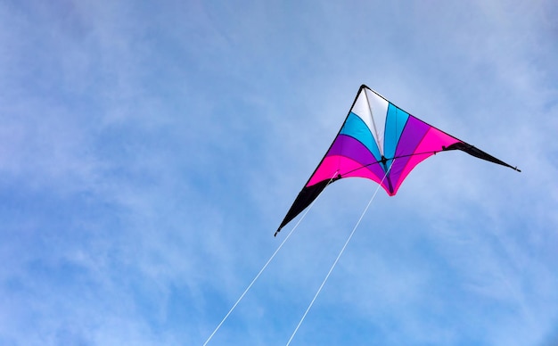 Colorful kite flying in the blue sky