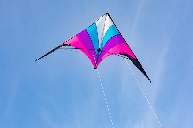 Colorful kite flying in the blue sky