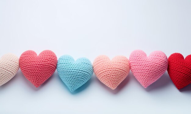 Colorful knitted hearts on a light background Valentines day concept