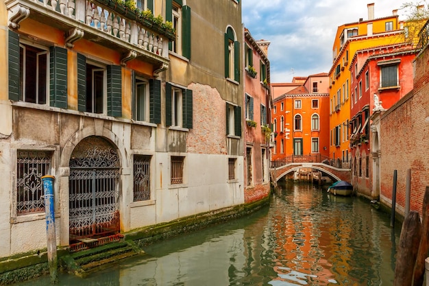 Colorful lateral canal and bridge in Venice Italy