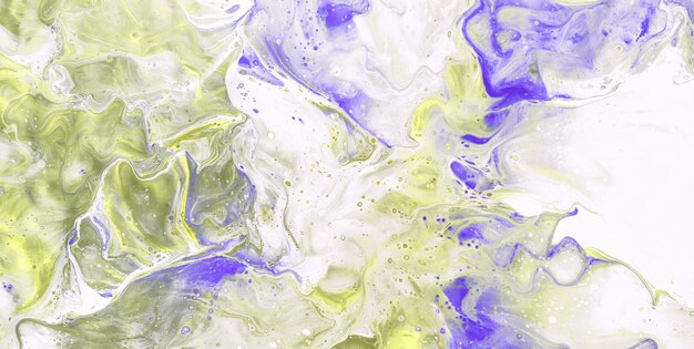 A colorful liquid with purple and yellow paint in it