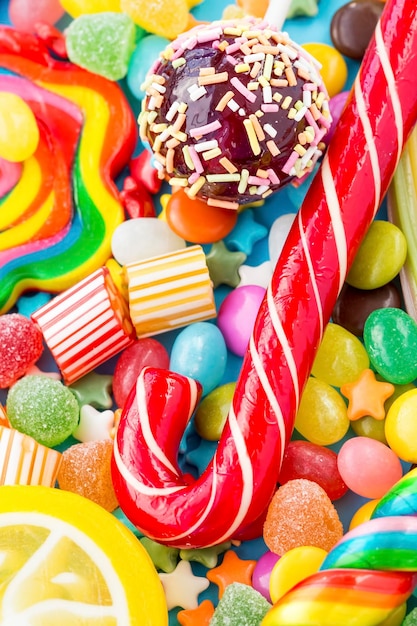 Colorful lollipops and different colored round candy. Top view.