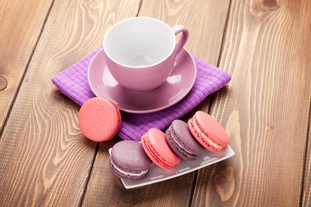 Colorful macaron cookies and coffee cup